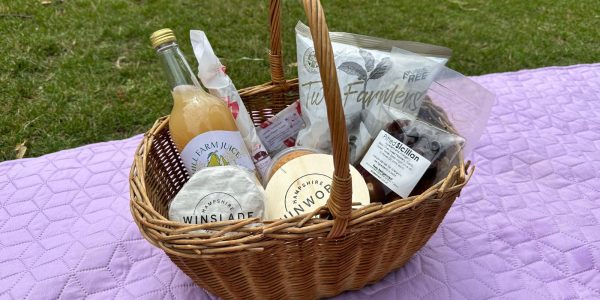 Tunworth and Winslade in picnic hamper with drinks and snacks